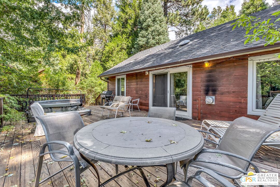 25300 Tahquitz Road Idyllwild, CA 92549 - Photo 5 of 75 a view of backyard with outdoor seating a patio and plants