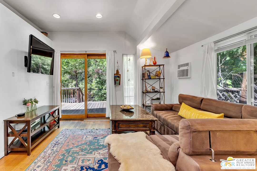 25300 Tahquitz Road Idyllwild, CA 92549 - Photo 66 of 75 a living room with furniture and a flat screen tv