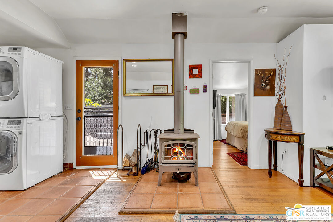 25300 Tahquitz Road Idyllwild, CA 92549 - Photo 67 of 75 a living room with furniture a rug and a window