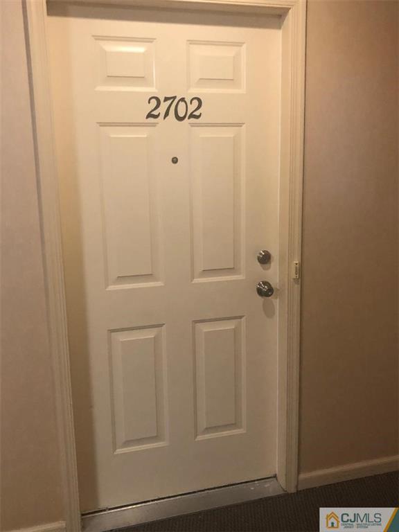 2702 Ridgefield Court, Unit 2702 Helmetta, NJ 08828 - Photo 2 of 8 a close view of door