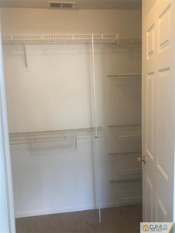 2702 Ridgefield Court, Unit 2702 Helmetta, NJ 08828 - Photo 6 of 8 a view of walk in closet
