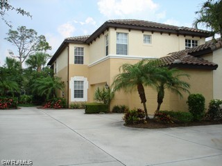 a front view of house with yard and outdoor seating