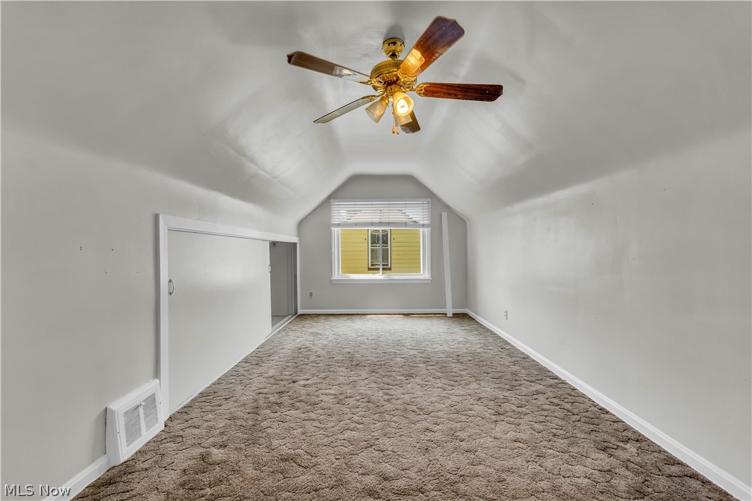 3842 Wallingford Road South Euclid, OH 44121 - Photo 22 of 31 Bonus room with ceiling fan, carpet floors, and lofted ceiling