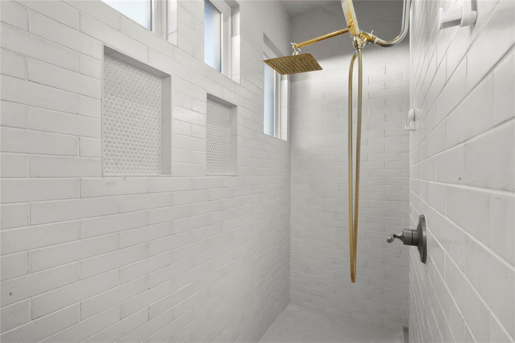 4033 Lagos Drive Midlothian, TX 76065 - Photo 14 of 29 a bathroom with a glass shower door