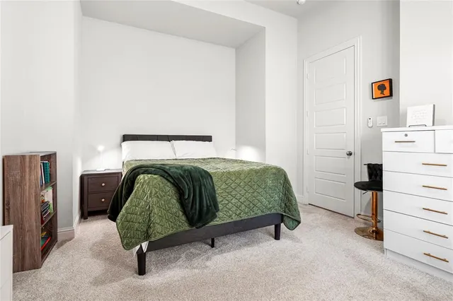 a bedroom with a bed and furniture