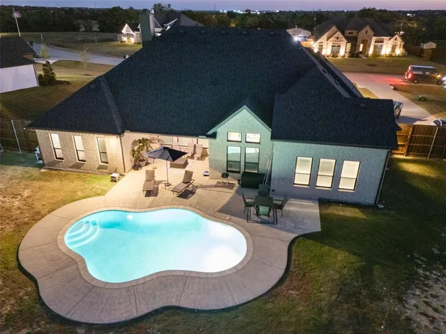 a view of a swimming pool with a patio