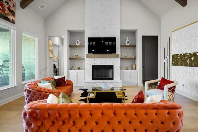 a bedroom with furniture and a flat screen tv