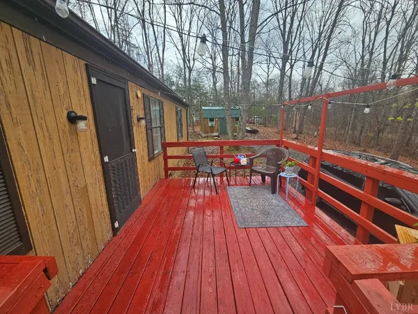 a balcony with view of outdoor space