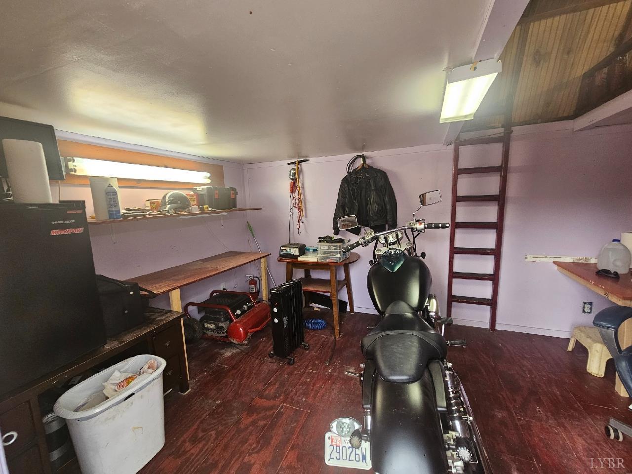413 Plum Branch Road Lynchburg, VA 24504 - Photo 12 of 22 a room with furniture a flat screen tv and a toilet