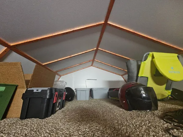 a bedroom with bed and cabinets
