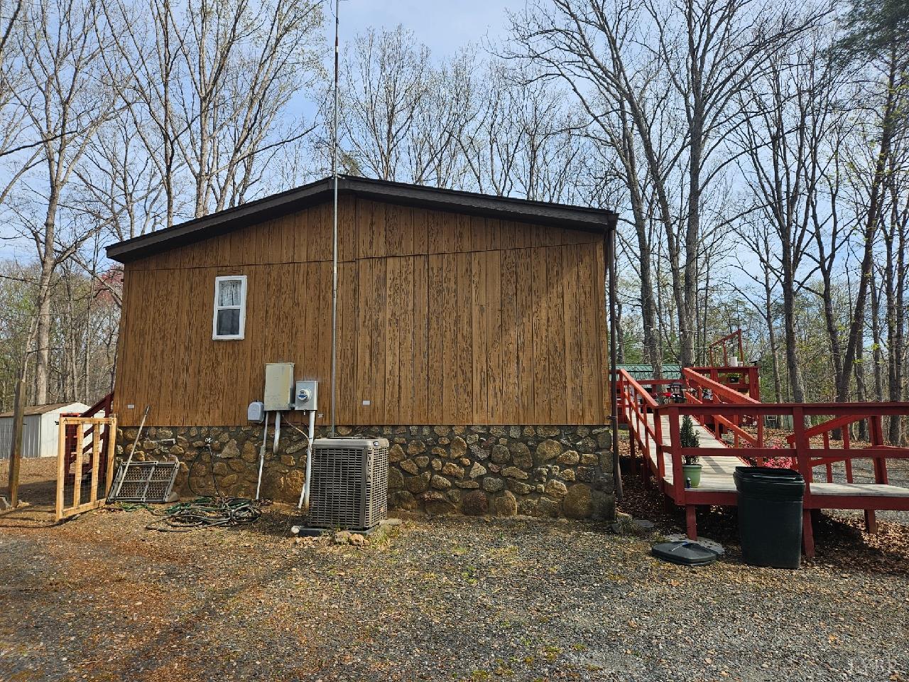 413 Plum Branch Road Lynchburg, VA 24504 - Photo 17 of 22 a backyard of a house with outdoor seating