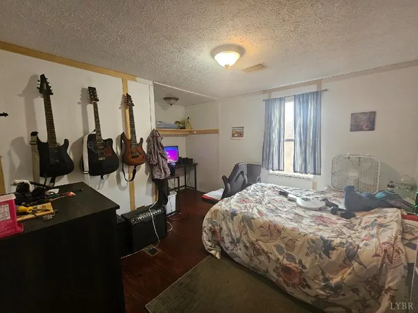 a bed room with a bed and gym equipment