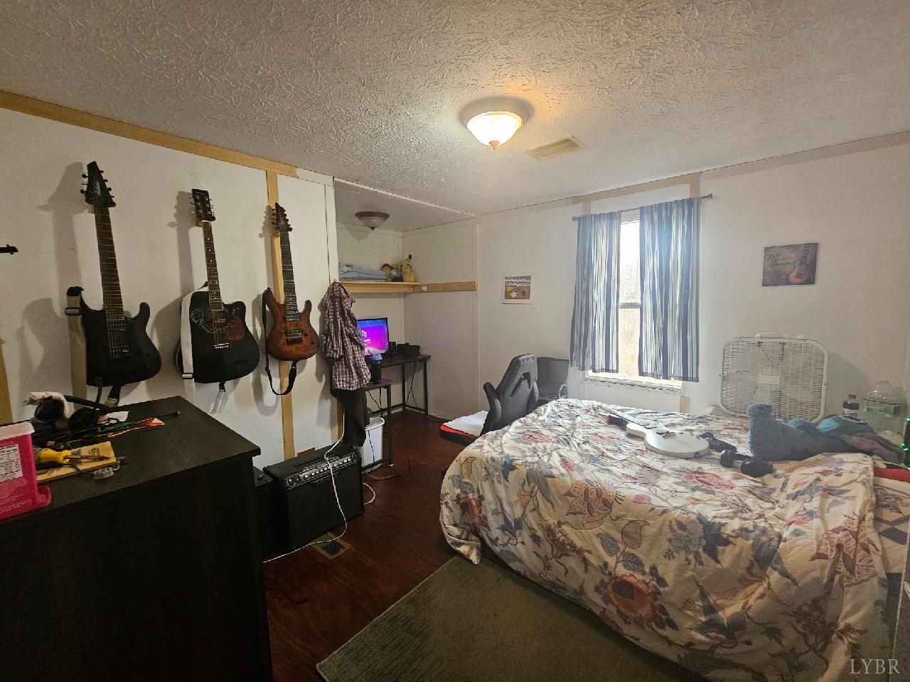 413 Plum Branch Road Lynchburg, VA 24504 - Photo 9 of 22 a bed room with a bed and gym equipment