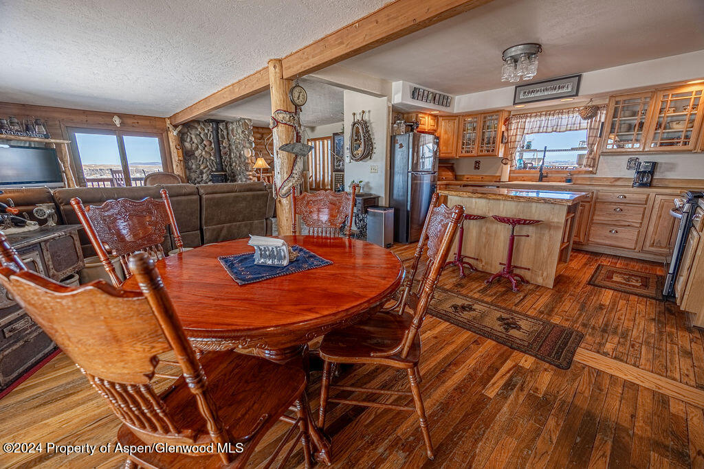 1020 Thompson Way Craig, CO 81625 - Photo 16 of 92 a outdoor dining space with furniture and wooden floor