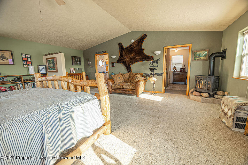 1020 Thompson Way Craig, CO 81625 - Photo 22 of 92 a bed room with a bed and a chair