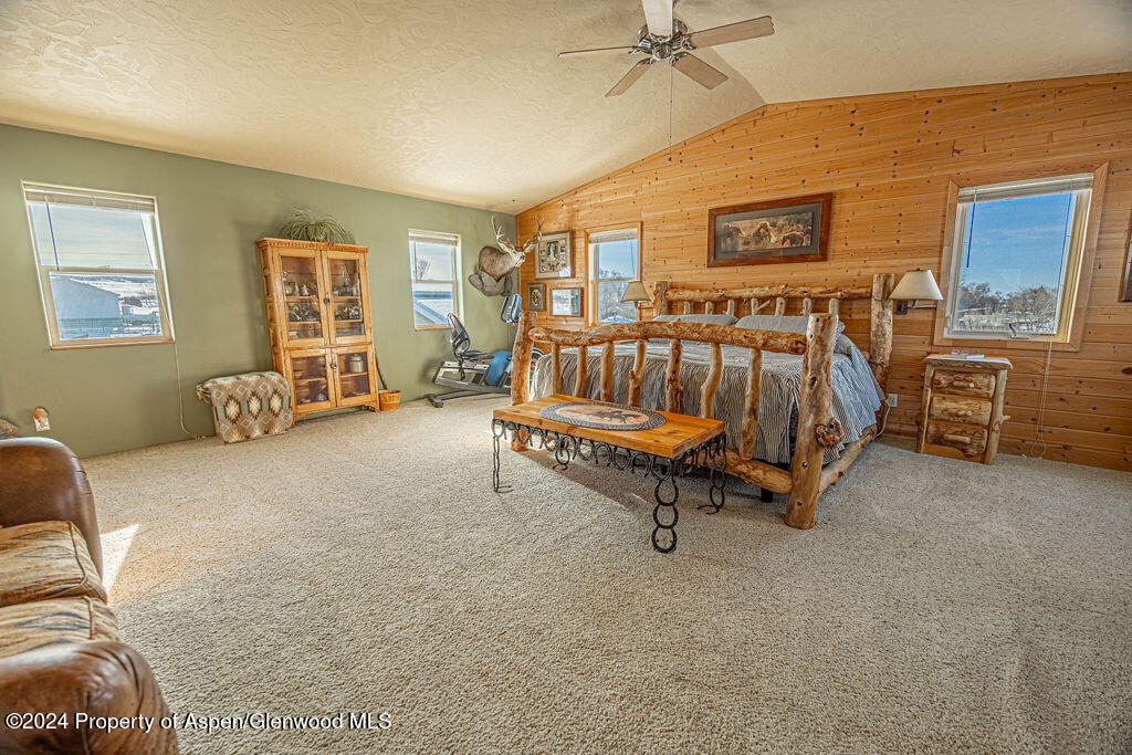 1020 Thompson Way Craig, CO 81625 - Photo 24 of 92 a living room with furniture and a flat screen tv