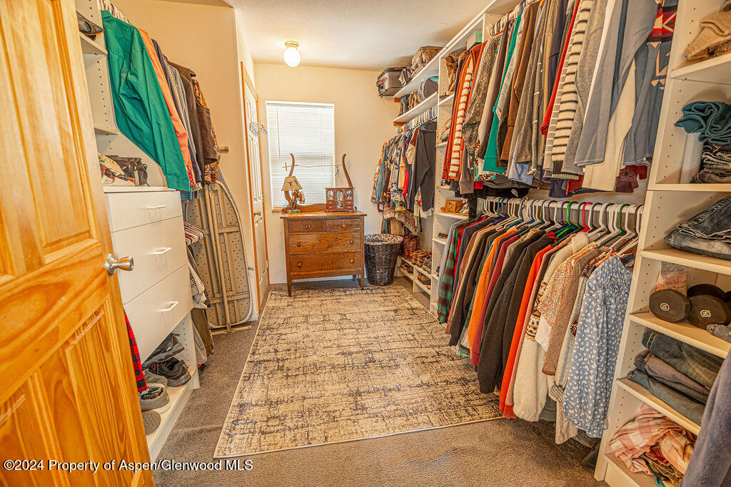 1020 Thompson Way Craig, CO 81625 - Photo 28 of 92 a view of walk in closet with clothes and shoes