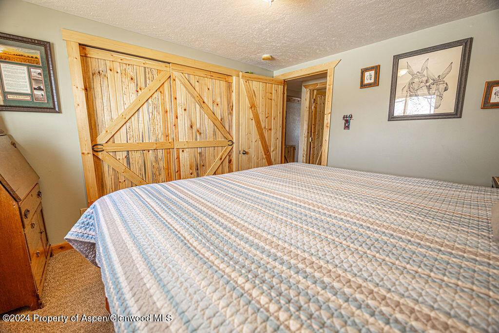 1020 Thompson Way Craig, CO 81625 - Photo 31 of 92 a bedroom with a bed and a window