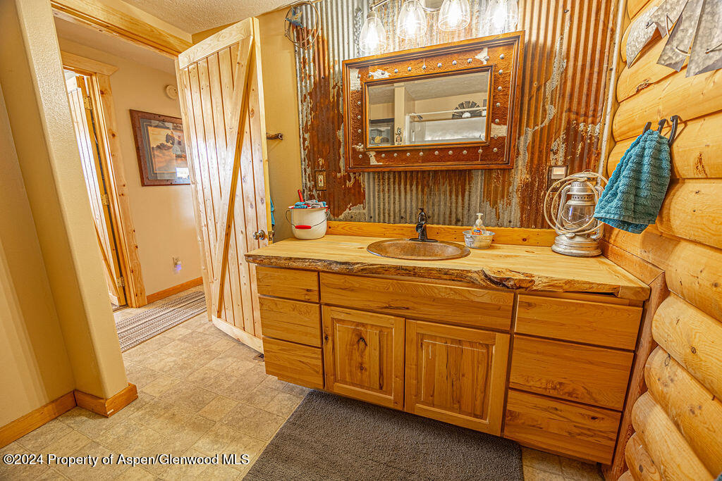 1020 Thompson Way Craig, CO 81625 - Photo 32 of 92 a bathroom with a sink and a mirror