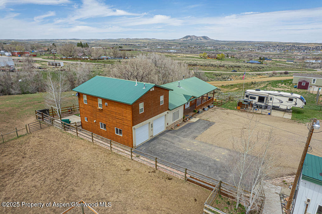1020 Thompson Way Craig, CO 81625 - Photo 43 of 92 aerial view of a house with outdoor space and lake view in back