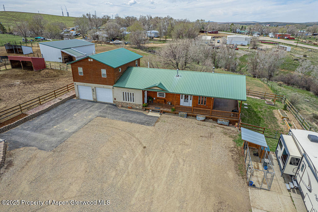 1020 Thompson Way Craig, CO 81625 - Photo 49 of 92 an aerial view of a house with a yard basket ball court and outdoor seating