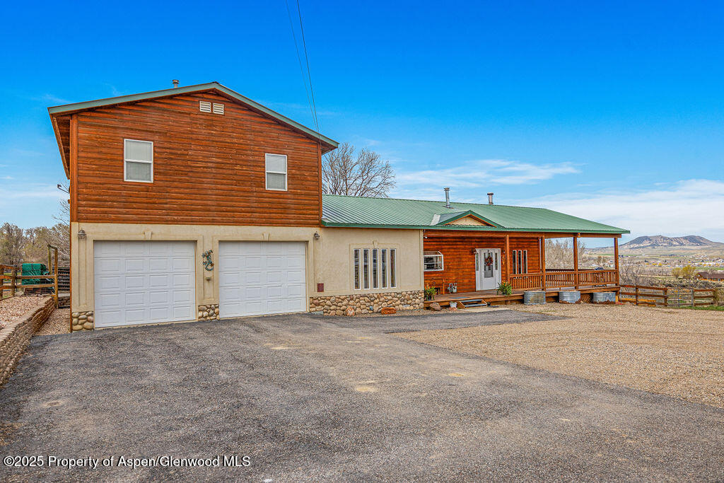 1020 Thompson Way Craig, CO 81625 - Photo 62 of 92 a front view of a house with a yard