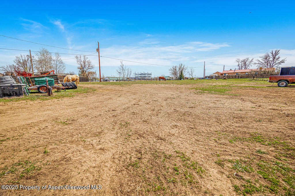 1020 Thompson Way Craig, CO 81625 - Photo 73 of 92 a view of a lake with boats and trees in the background