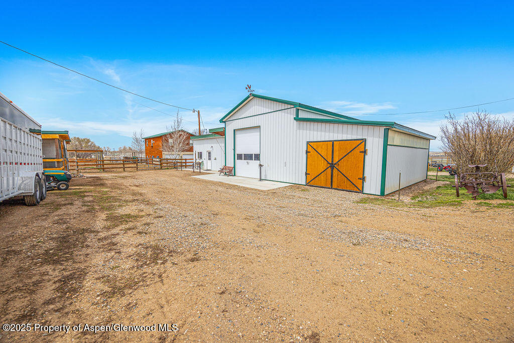 1020 Thompson Way Craig, CO 81625 - Photo 75 of 92 a view of a house with backyard and trees