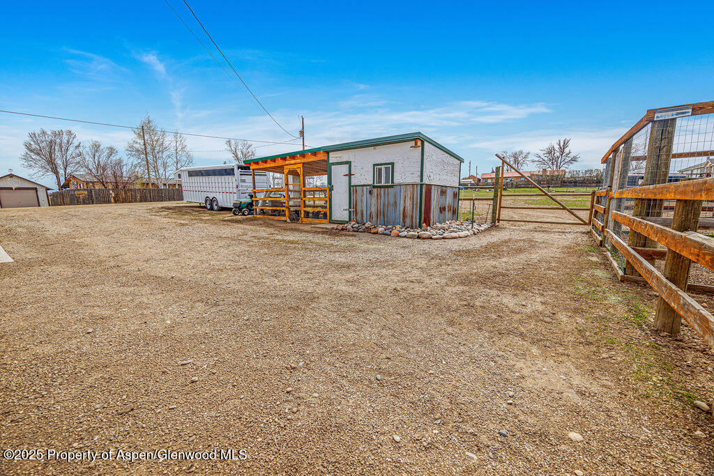 1020 Thompson Way Craig, CO 81625 - Photo 77 of 92 a view of residential houses with yard and car parked