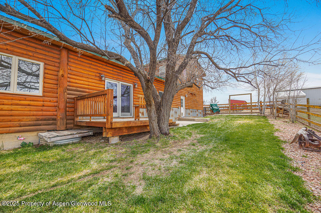 1020 Thompson Way Craig, CO 81625 - Photo 79 of 92 a view of a backyard with a large tree