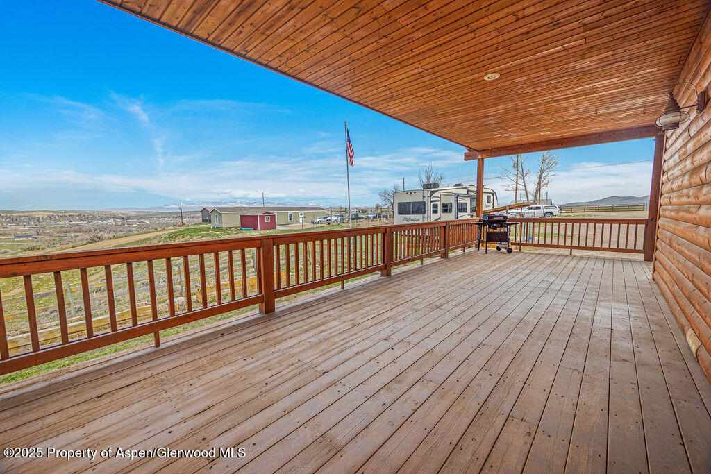 1020 Thompson Way Craig, CO 81625 - Photo 83 of 92 a view of a balcony with wooden floor