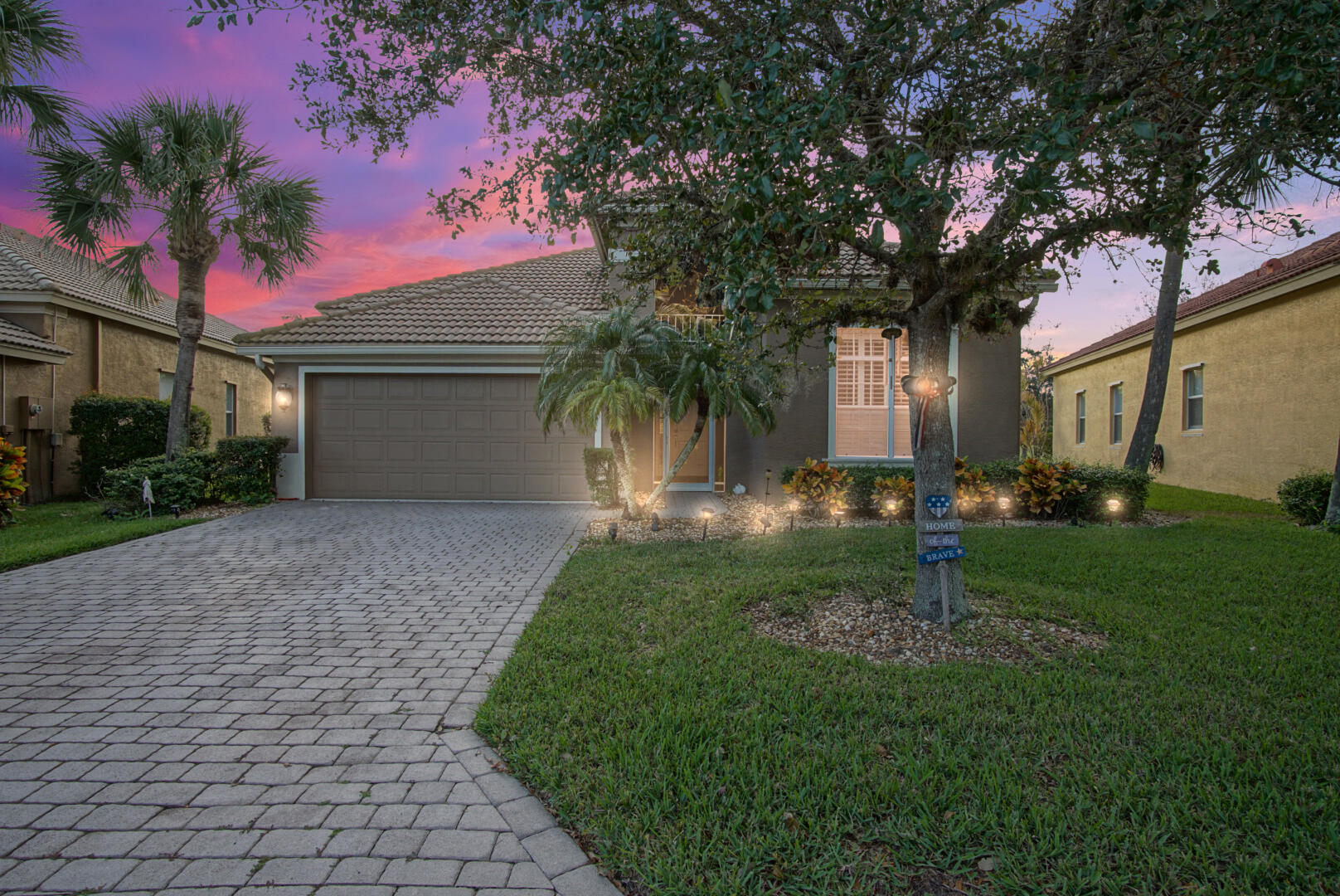 306 Northwest Whitby Court Port St. Lucie, FL 34983 - Photo 1 of 30 a front view of a house with garden
