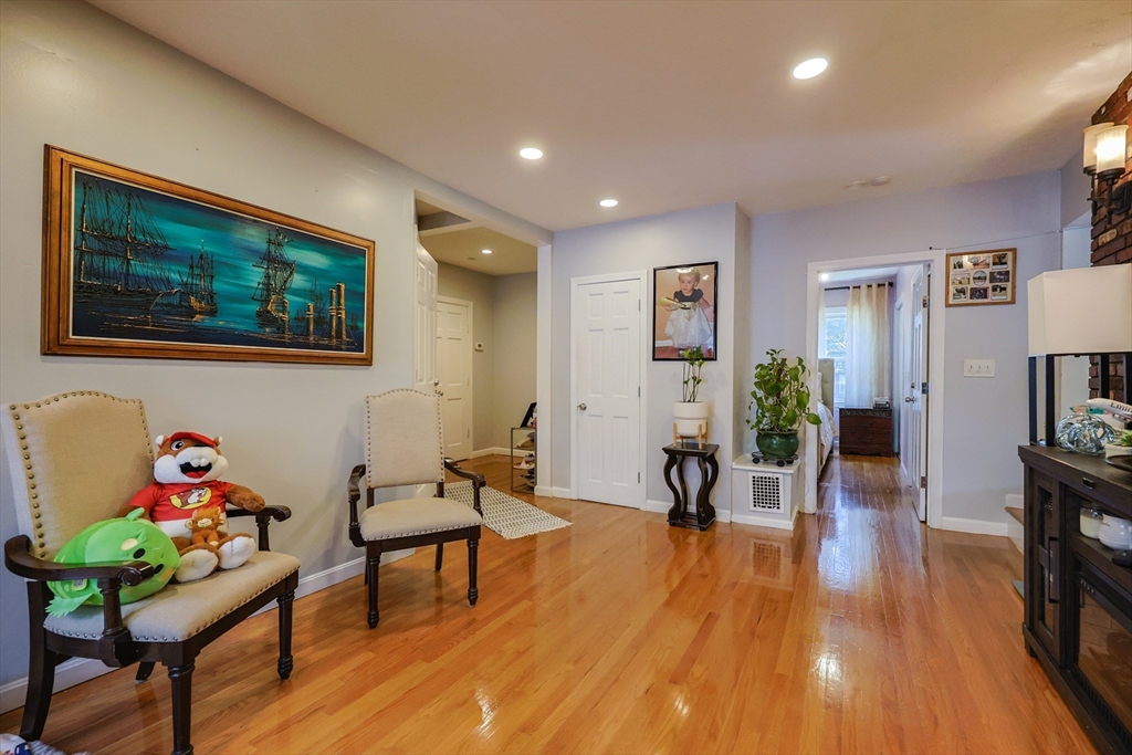 7 Jackson Court, Unit B Natick, MA 01760 - Photo 11 of 28 a living room with furniture and a wooden floor