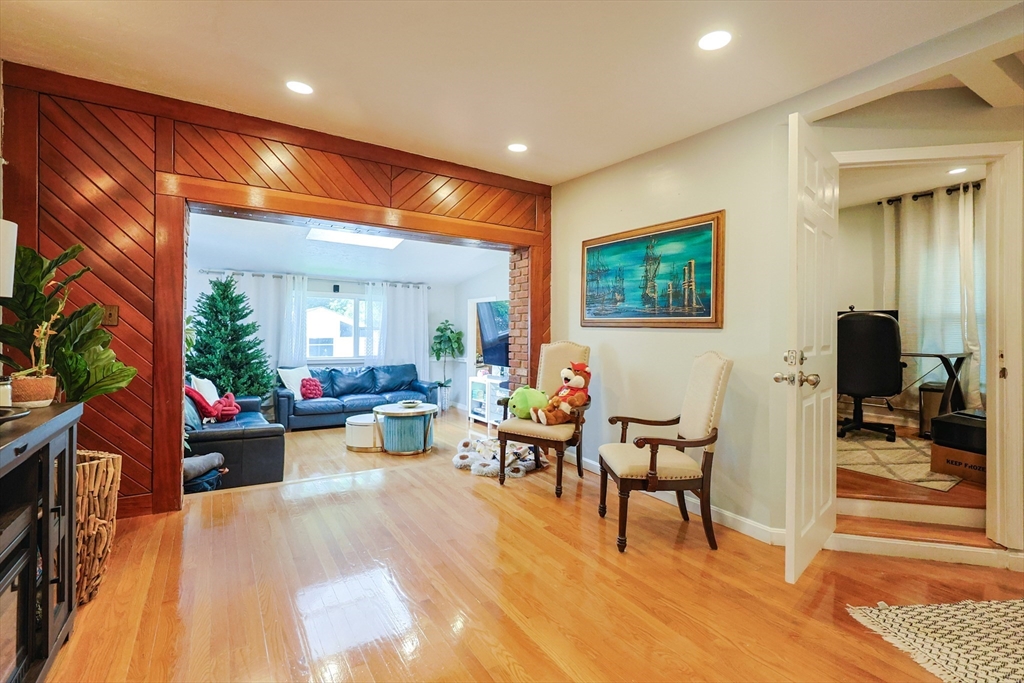 7 Jackson Court, Unit B Natick, MA 01760 - Photo 12 of 28 a living room with furniture and a painting on the wall