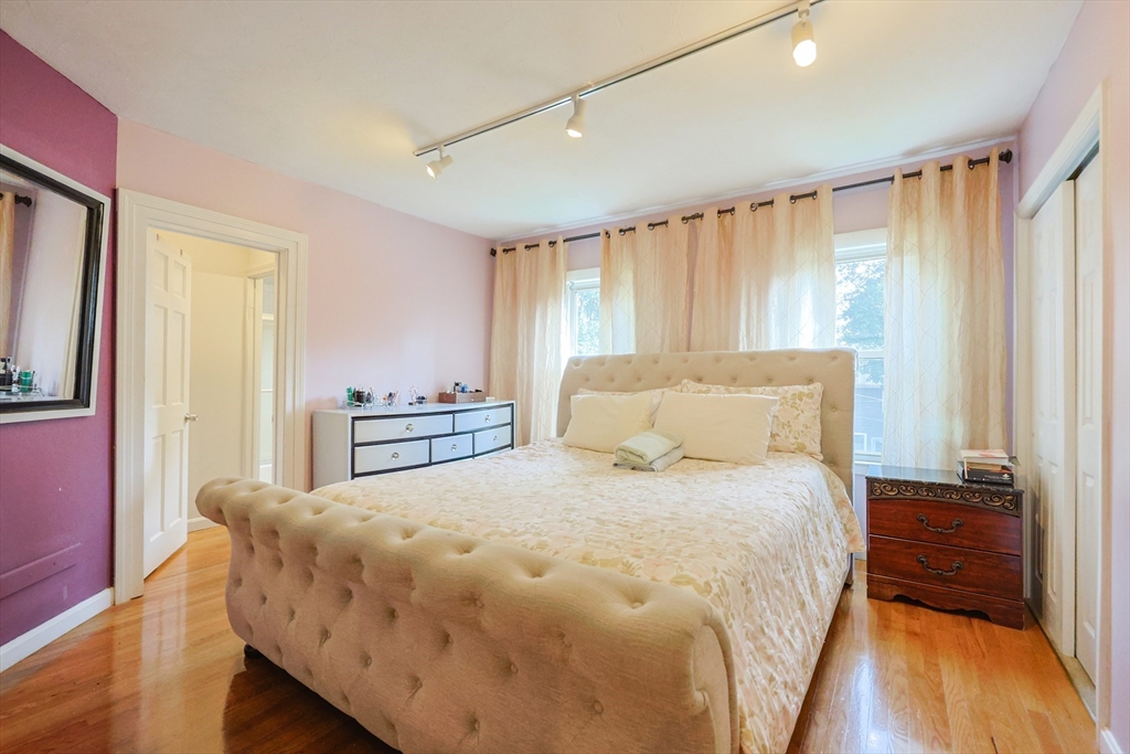7 Jackson Court, Unit B Natick, MA 01760 - Photo 15 of 28 a spacious bedroom with a bed and a window
