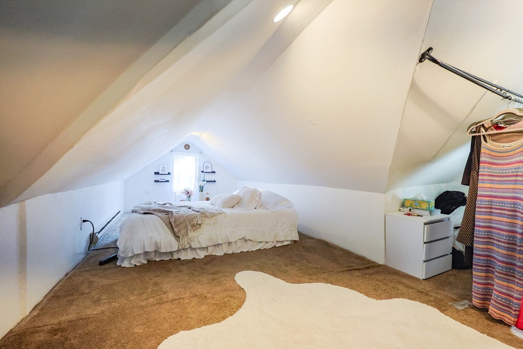 7 Jackson Court, Unit B Natick, MA 01760 - Photo 19 of 28 a spacious bedroom with a bed and a window