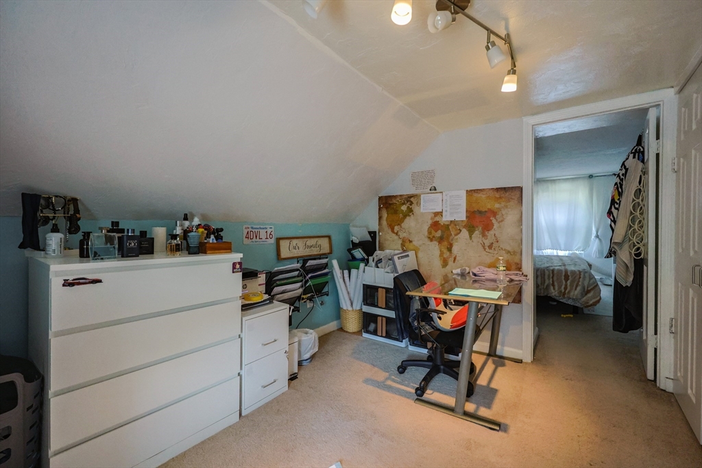 7 Jackson Court, Unit B Natick, MA 01760 - Photo 22 of 28 a bed room with a bed and a chair