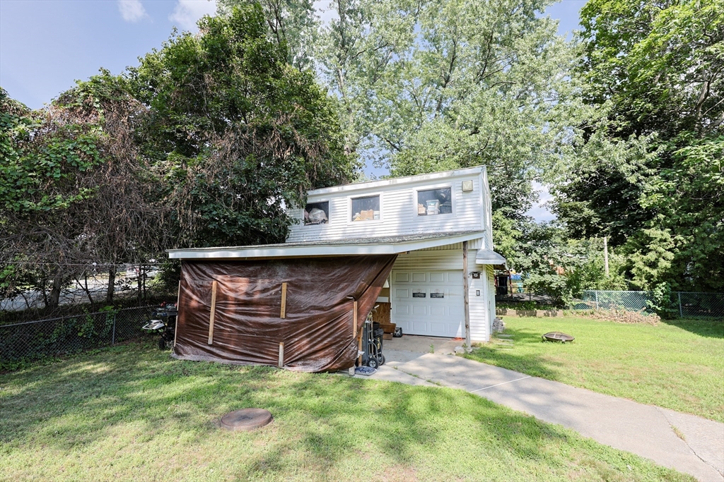 7 Jackson Court, Unit B Natick, MA 01760 - Photo 26 of 28 front view of a house with a yard