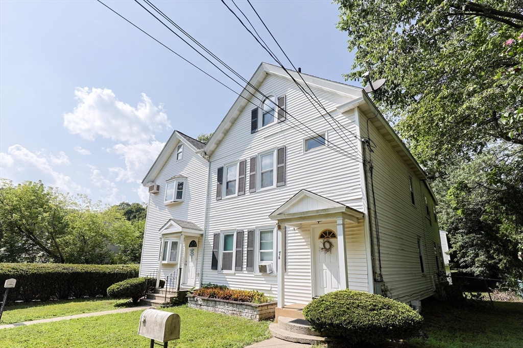 7 Jackson Court, Unit B Natick, MA 01760 - Photo 3 of 28 a front view of a house with garden