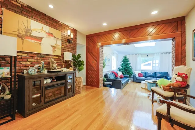 a view of a living room and a wooden floor