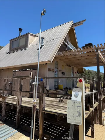 a view of a patio with table and chairs