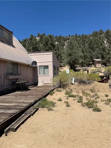 a view of a backyard of the house