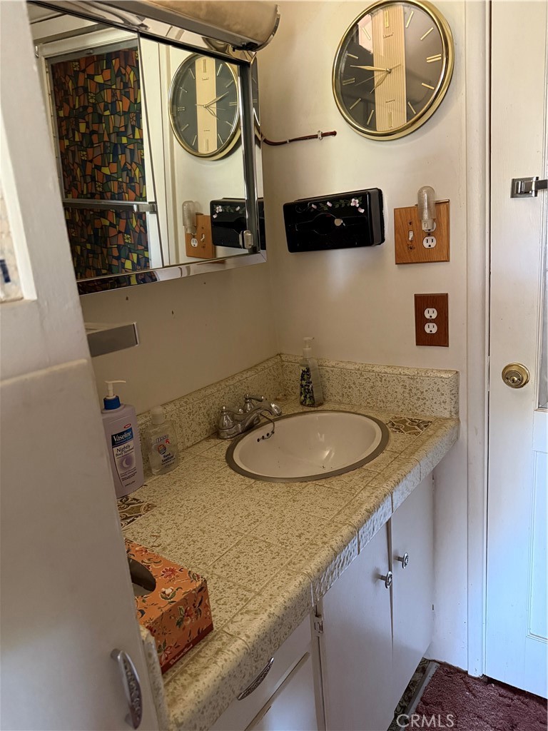 97940 Deodar Road Kennedy Meadows, CA 93527 - Photo 20 of 21 a bathroom with a sink and a mirror