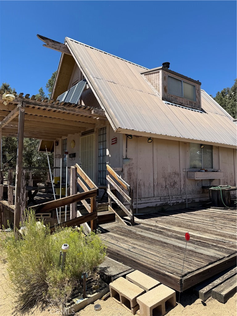 97940 Deodar Road Kennedy Meadows, CA 93527 - Photo 5 of 21 a view of a house with a wooden deck
