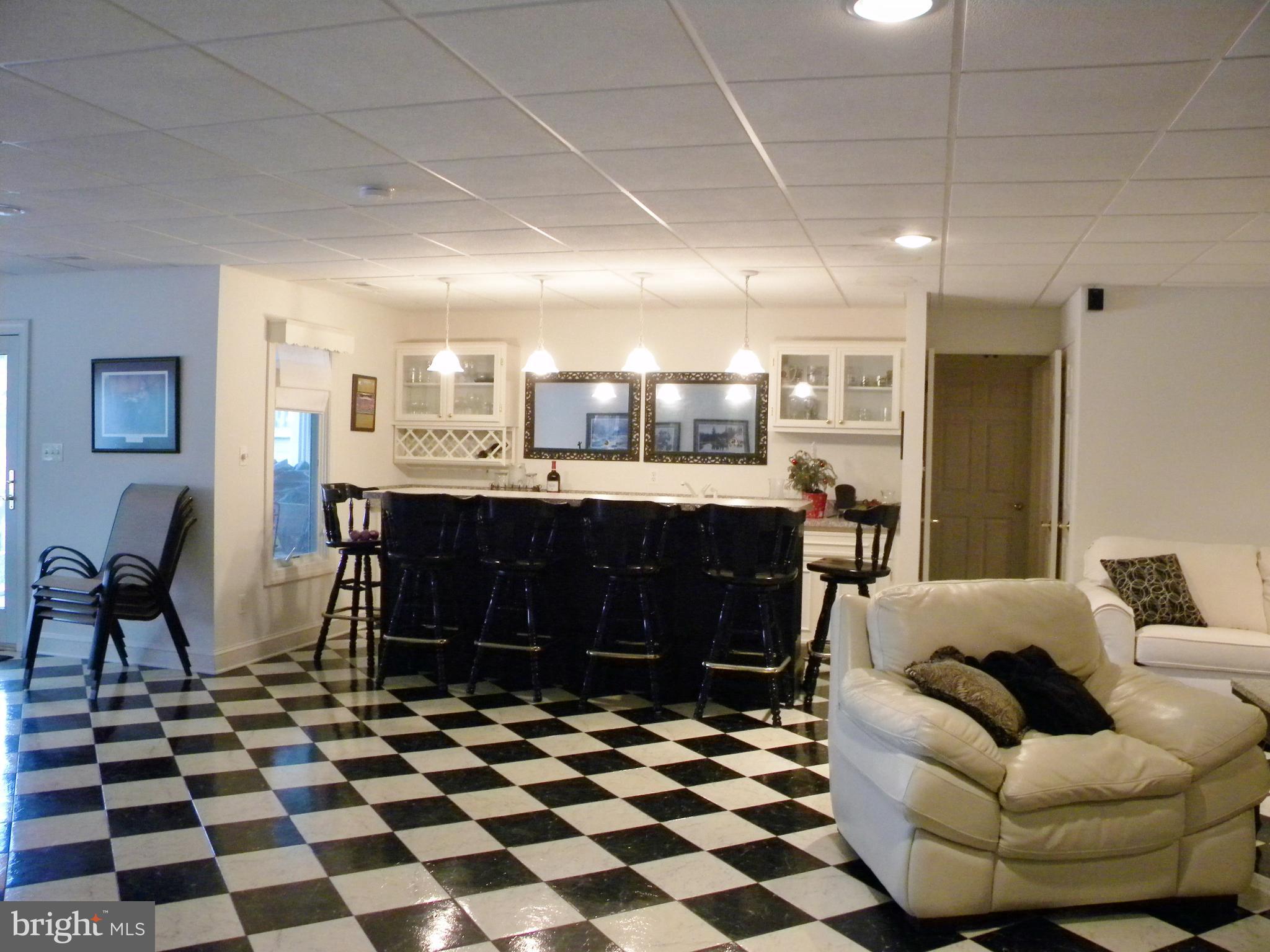10767 Cliff Mills Road Marshall, VA 20115 - Photo 21 of 30 Basement bar area and family room