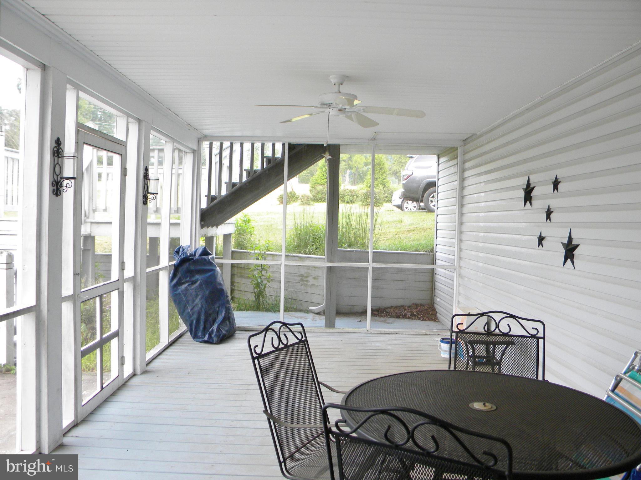 10767 Cliff Mills Road Marshall, VA 20115 - Photo 25 of 30 Screened in porch leading to grill area & pool