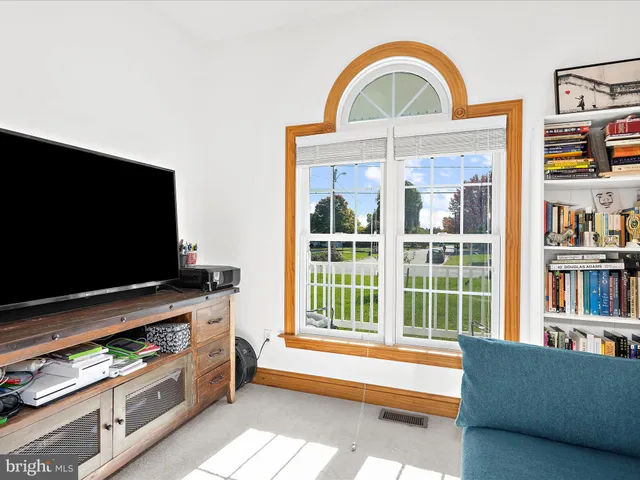 a living room with television and a flat screen tv