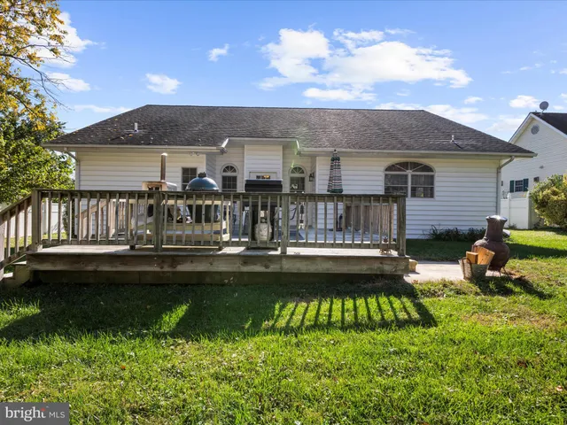 a view of a house with swimming pool and sitting area
