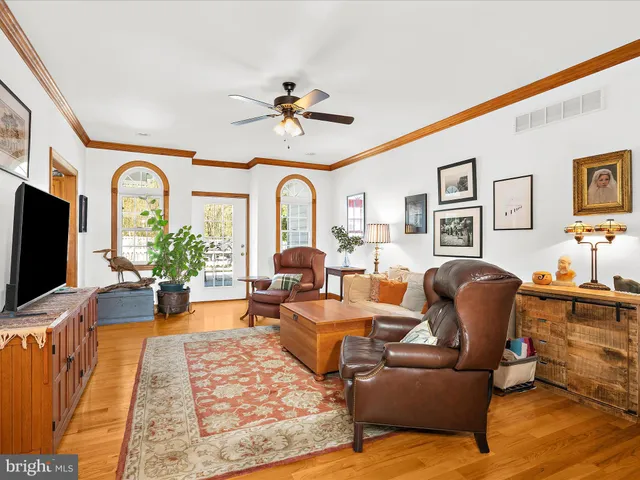 a living room with fireplace furniture and a flat screen tv