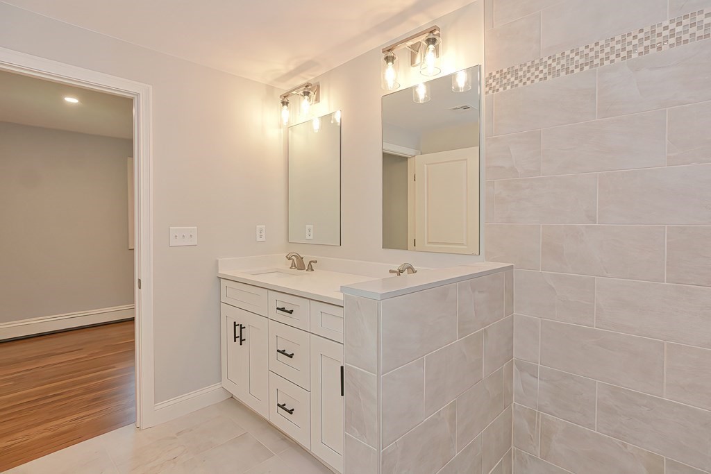 31 Clarkson Drive Walpole, MA 02081 - Photo 18 of 36 a bathroom with a double vanity sink mirror and double